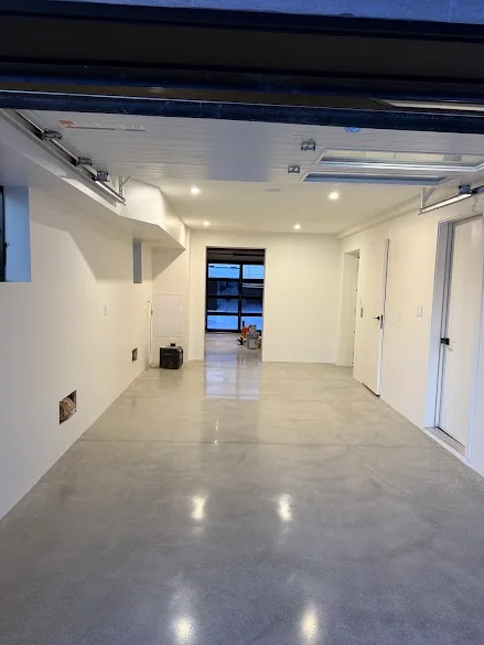Bright white finished garage interior painted by Andy's Painting LLC