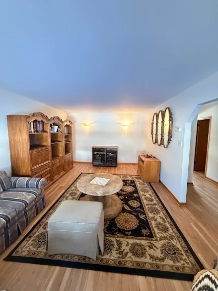 Living room freshly painted by Andy's Painting LLC with clean white walls and ceiling